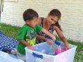 Vinnie's scooping sand, playing, and talking with Mom.